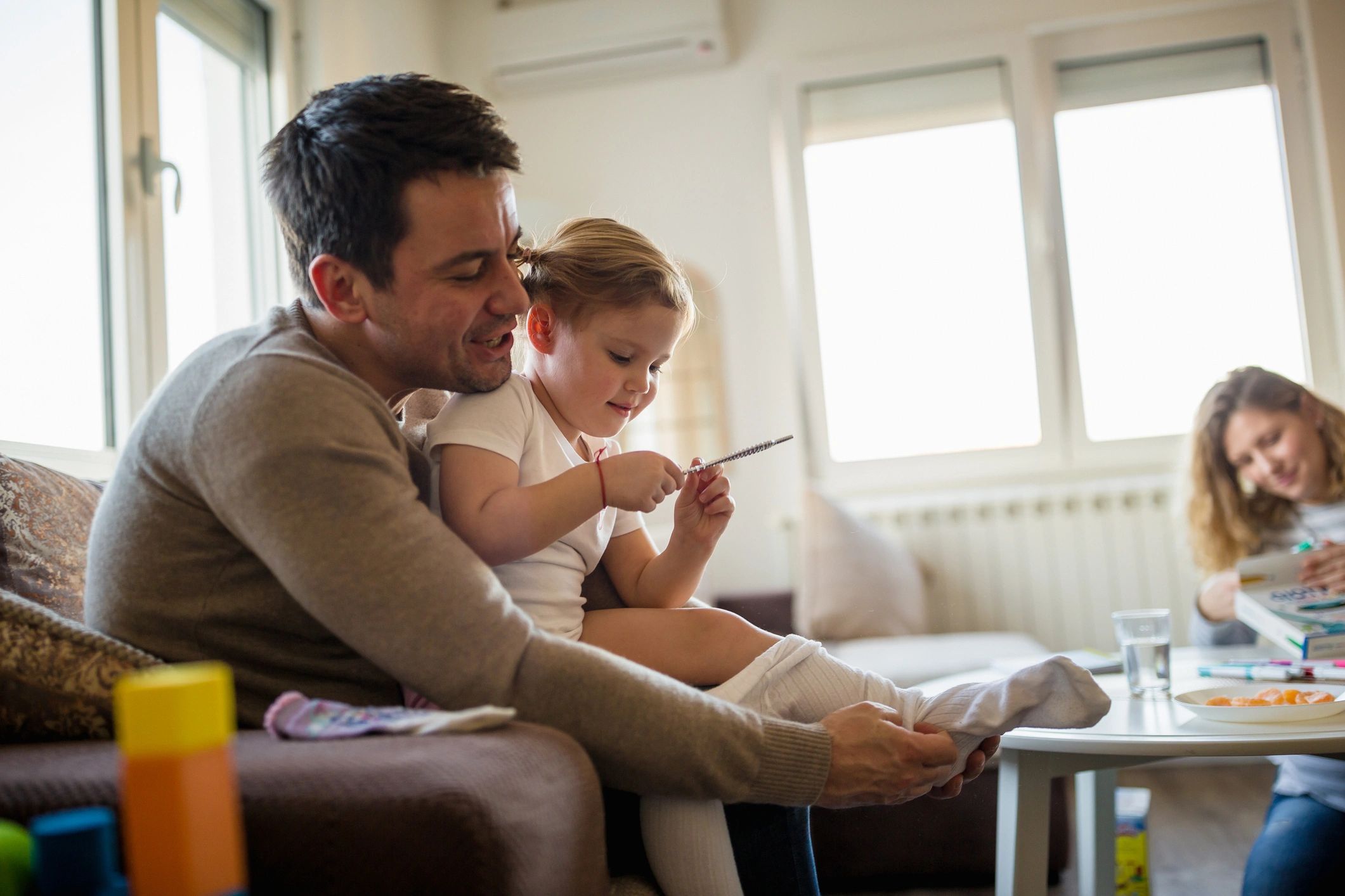 Parent and child spending time together on a couch